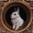 Close-up of framed bunny art print in round Baroque gilt frame