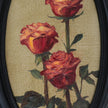 Original red roses oil painting in an ornate long oval gilt frame on cream linen, close up view