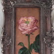 Close up original pink rose oil painting in an long narrow gilt frame on cream linen 