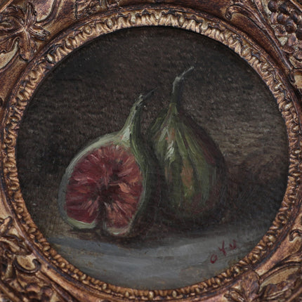 close up of the fig still life oil painting in round gilt frame on cream fabric