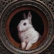 Close-up of white bunny painting print in ornate bronze gilt frame