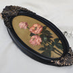 Original pink rose oil painting in an long oval gilt frame on cream linen, another side view