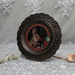 Framed bunny art print in ornate bronze frame standing, side view