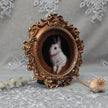 Framed bunny art print in round Baroque gilt frame, side view