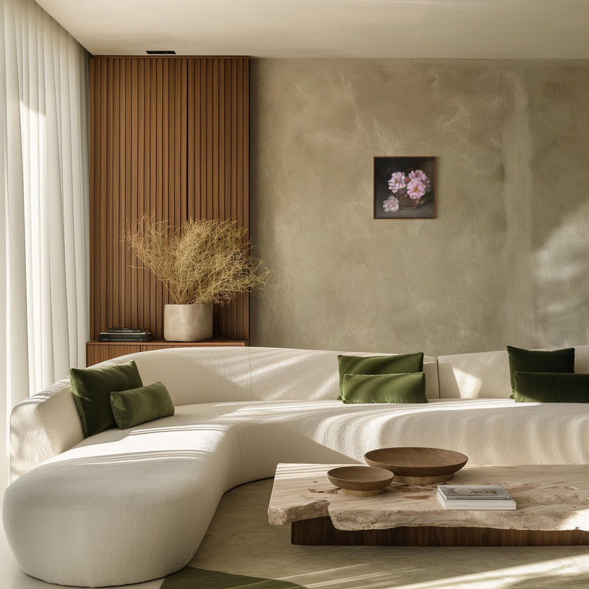 Mockup of the painting in a modern curved white sectional sofa in a sunlit contemporary living room, styled with olive green throw pillows, a marble coffee table, and a textured beige wall.