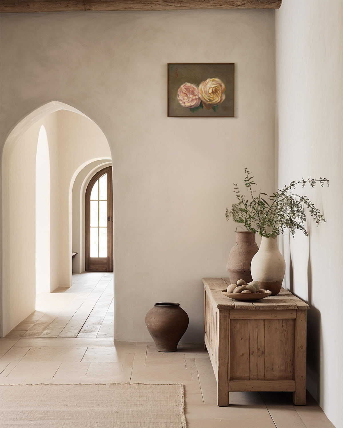 Mockup of the rose painting handing in a rustic interior scene on a beige plaster wall.