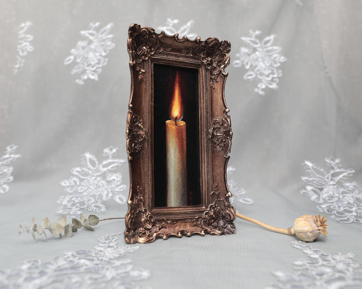 Side angle of long narrow bronze frame with candle flame painting print