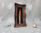 Side angle of long narrow bronze frame with candle flame painting print