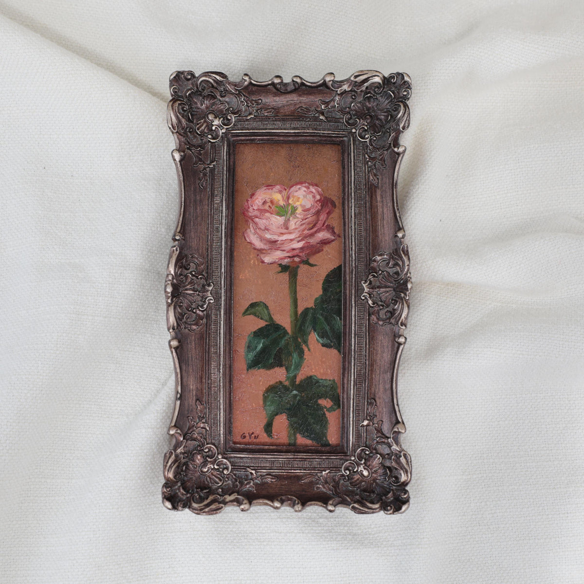 Original pink rose oil painting in an long narrow gilt frame on cream linen 