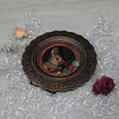 Framed bunny art print in ornate bronze frame, top view