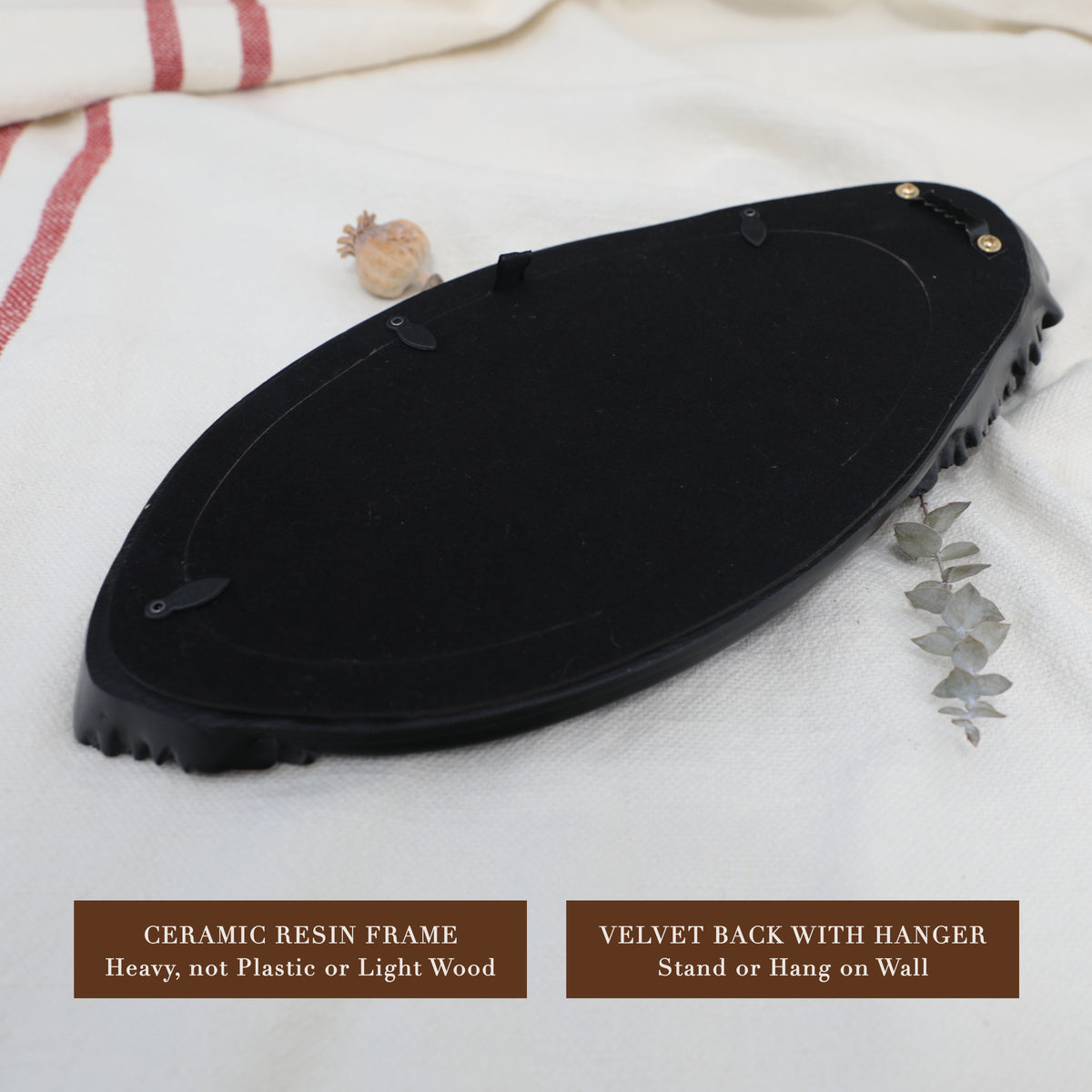 Back of frame showing hanging hardware and velvet-lined backside.