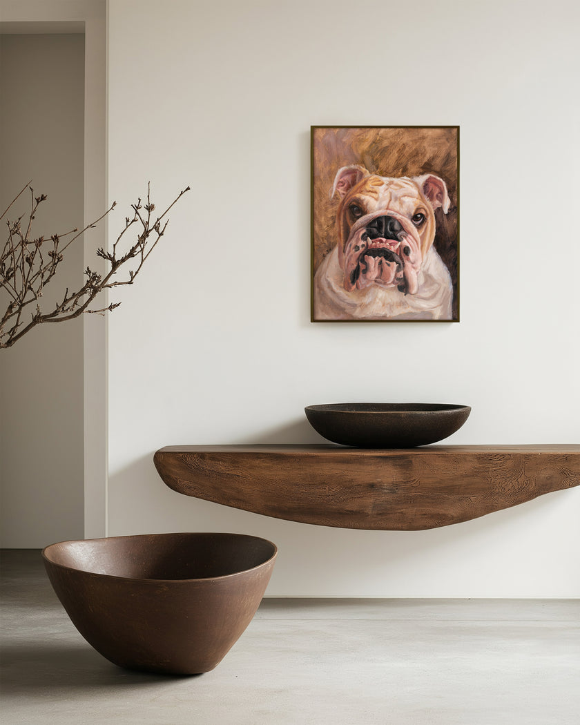 Framed custom bulldog oil portrait displayed in a bright, cozy living room