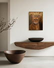 oil painting of an orange tabby cat with green eyes, detailed fur, and white whiskers, hanging in a cozy modern room. 