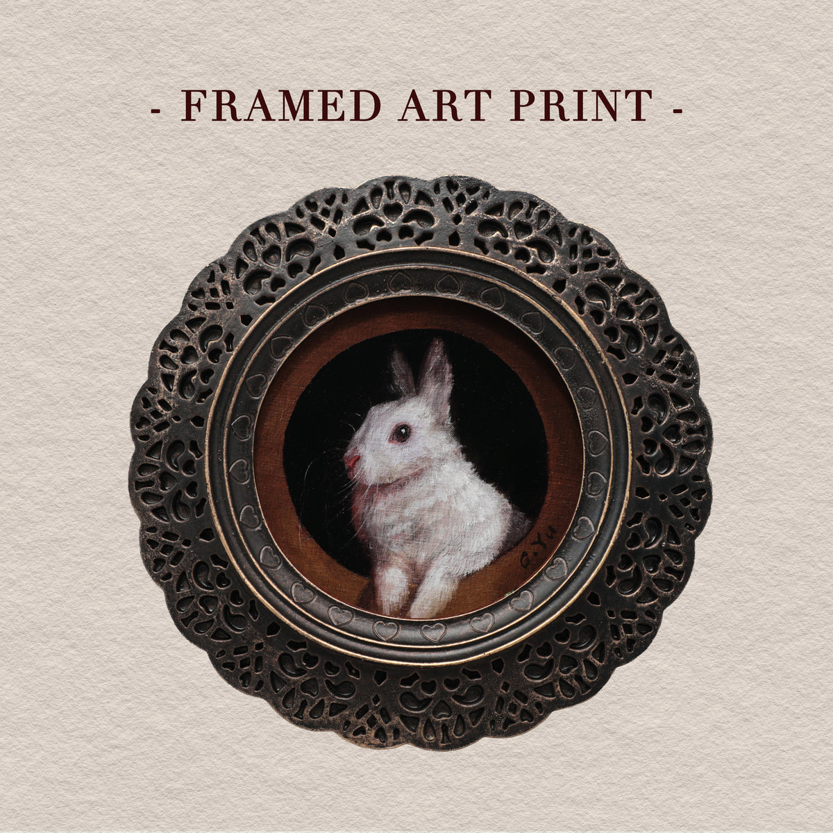Framed bunny art print in round gilt frame