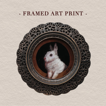 Framed bunny art print in round gilt frame