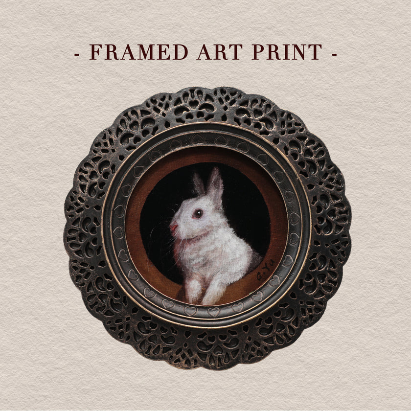 Framed bunny art print in round gilt frame
