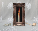 Candle flame still life painting print in long narrow bronze frame, standing