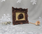 Small framed Cottontail Rabbit painting print in ornate frame, side view