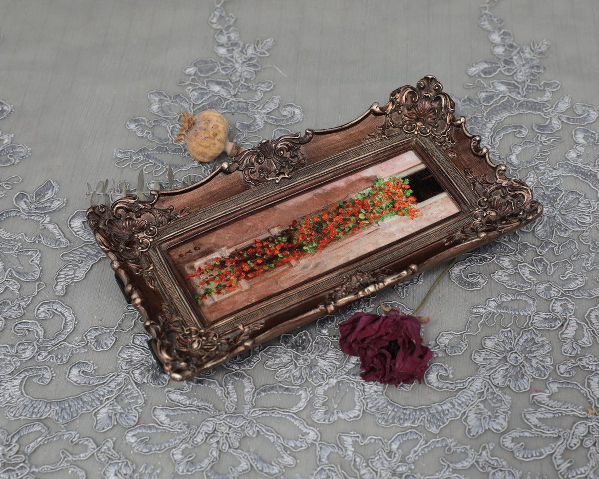Long nasturtium art print laid flat with dried rose and poppy